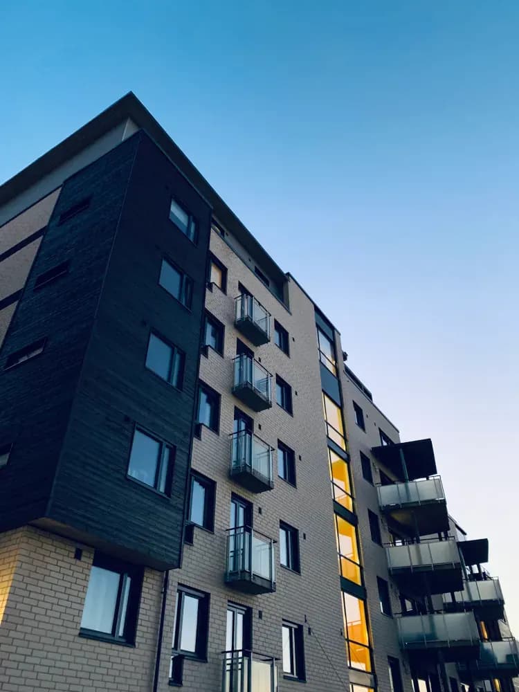 Low angle photo of high rise apartment building