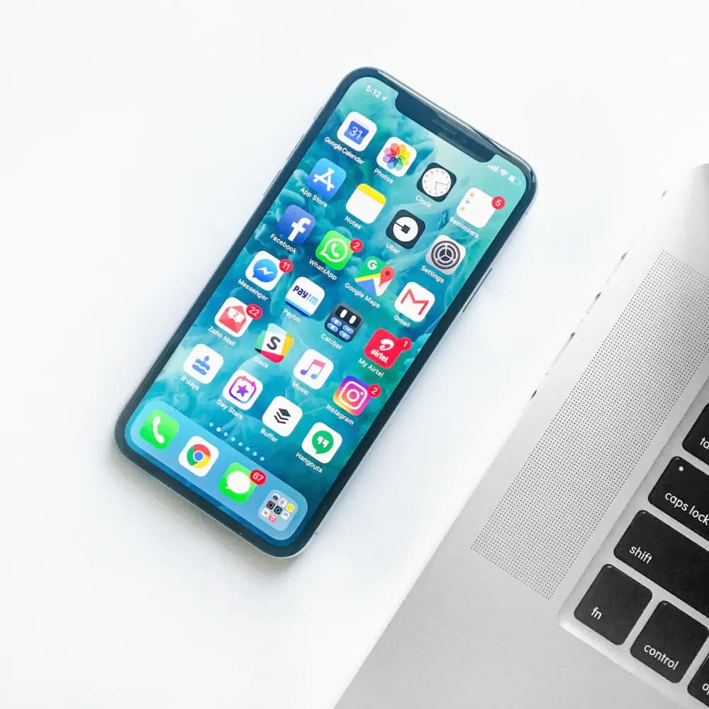 Smartphone and laptop workspace