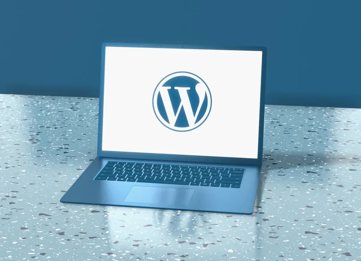 Laptop displaying wordpress logo